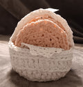 Handmade pink coasters in white basket