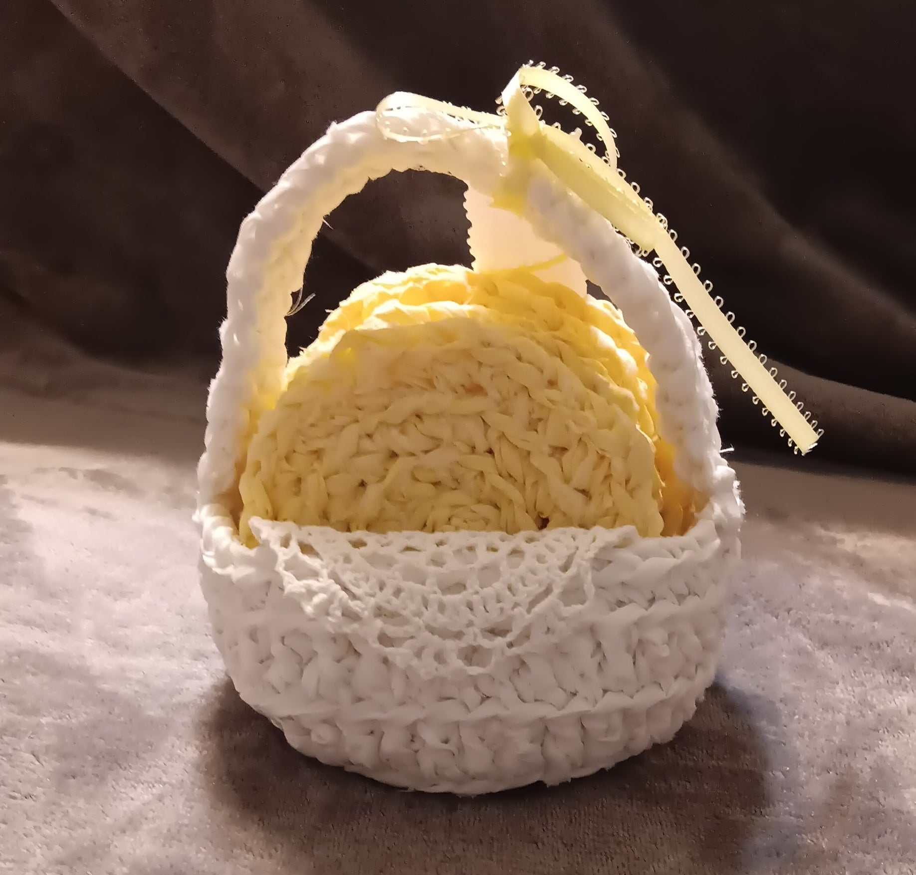 Handmade yellow coasters in white basket