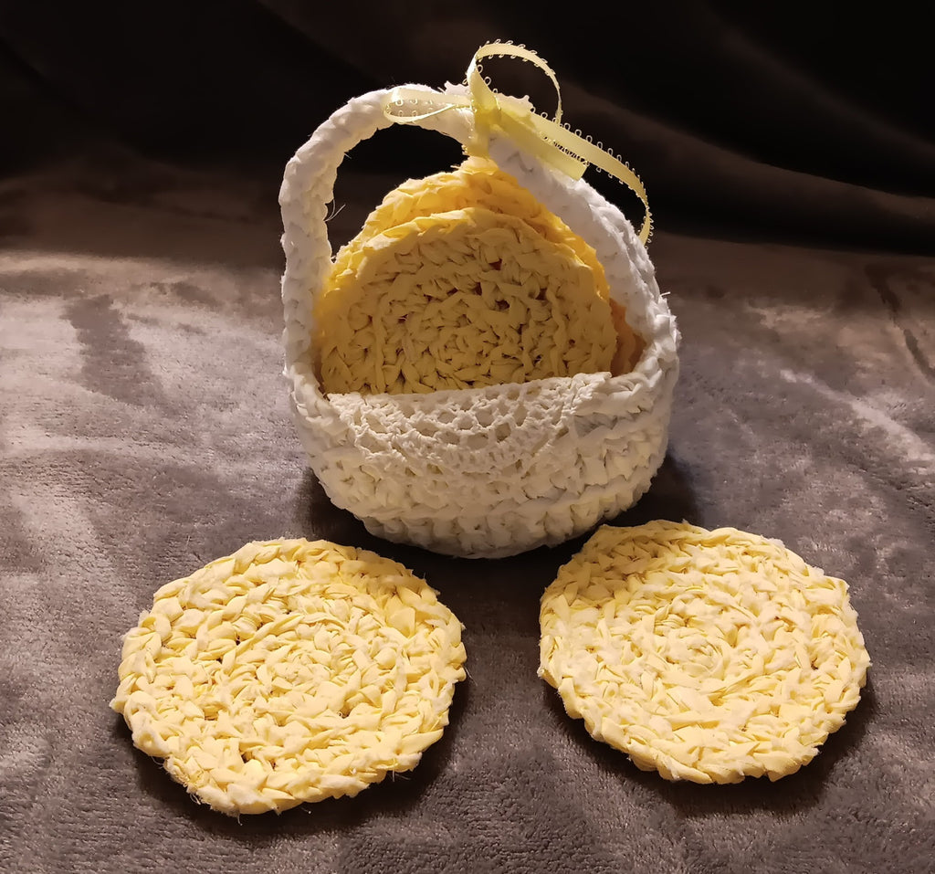 Handmade yellow coasters in white basket