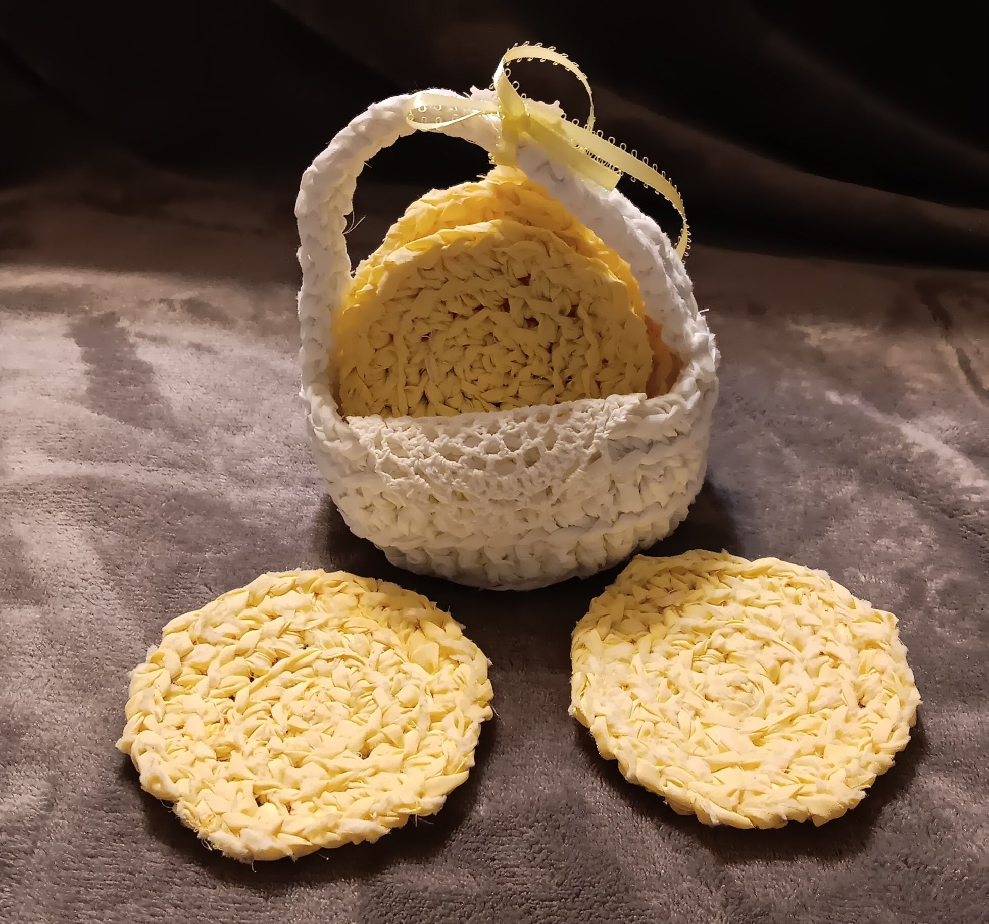 Handmade yellow coasters in white basket