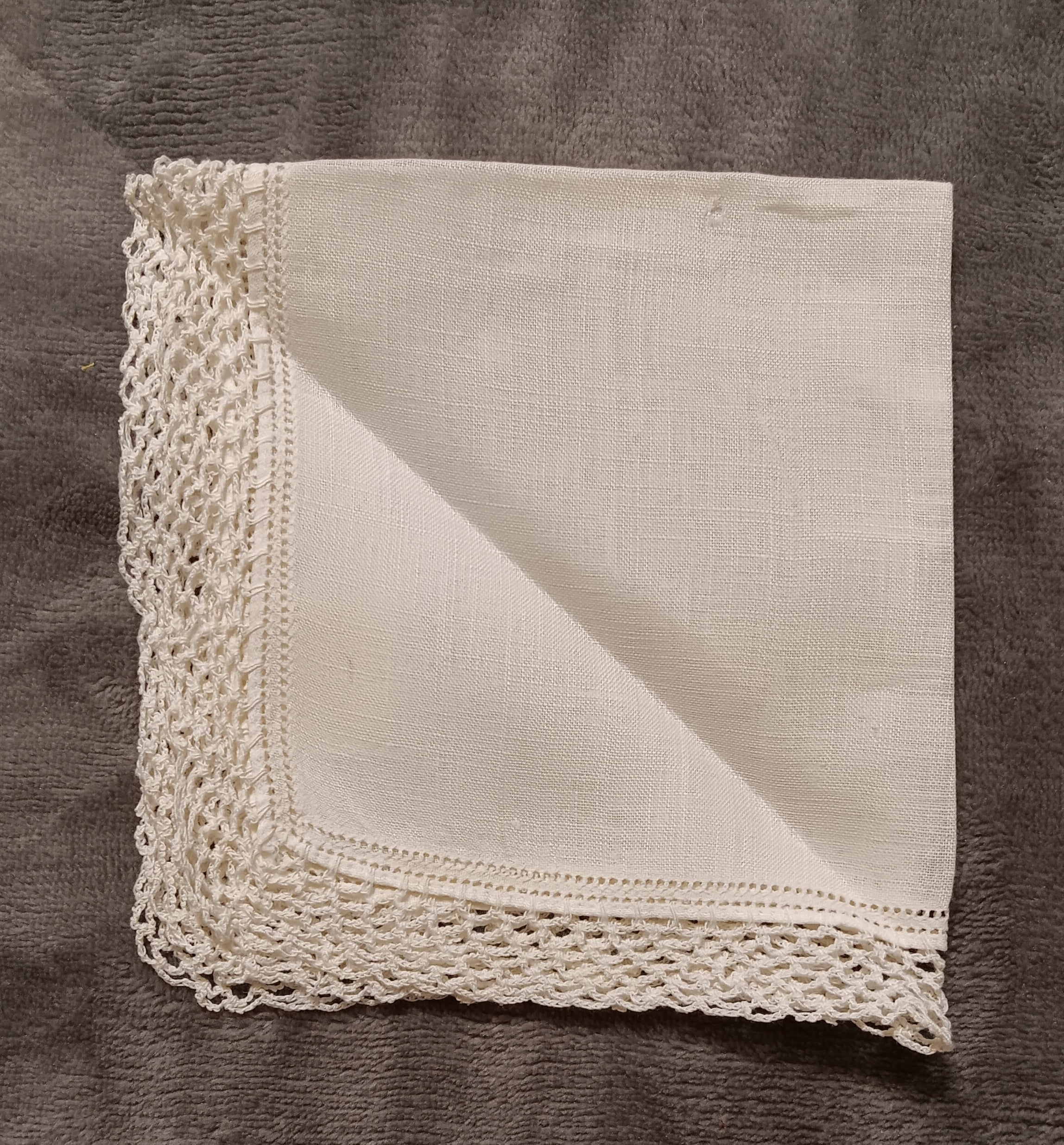 White handkerchief with white lace
