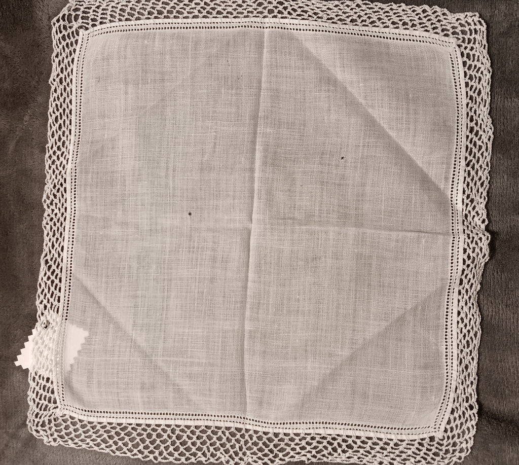 White handkerchief with white lace