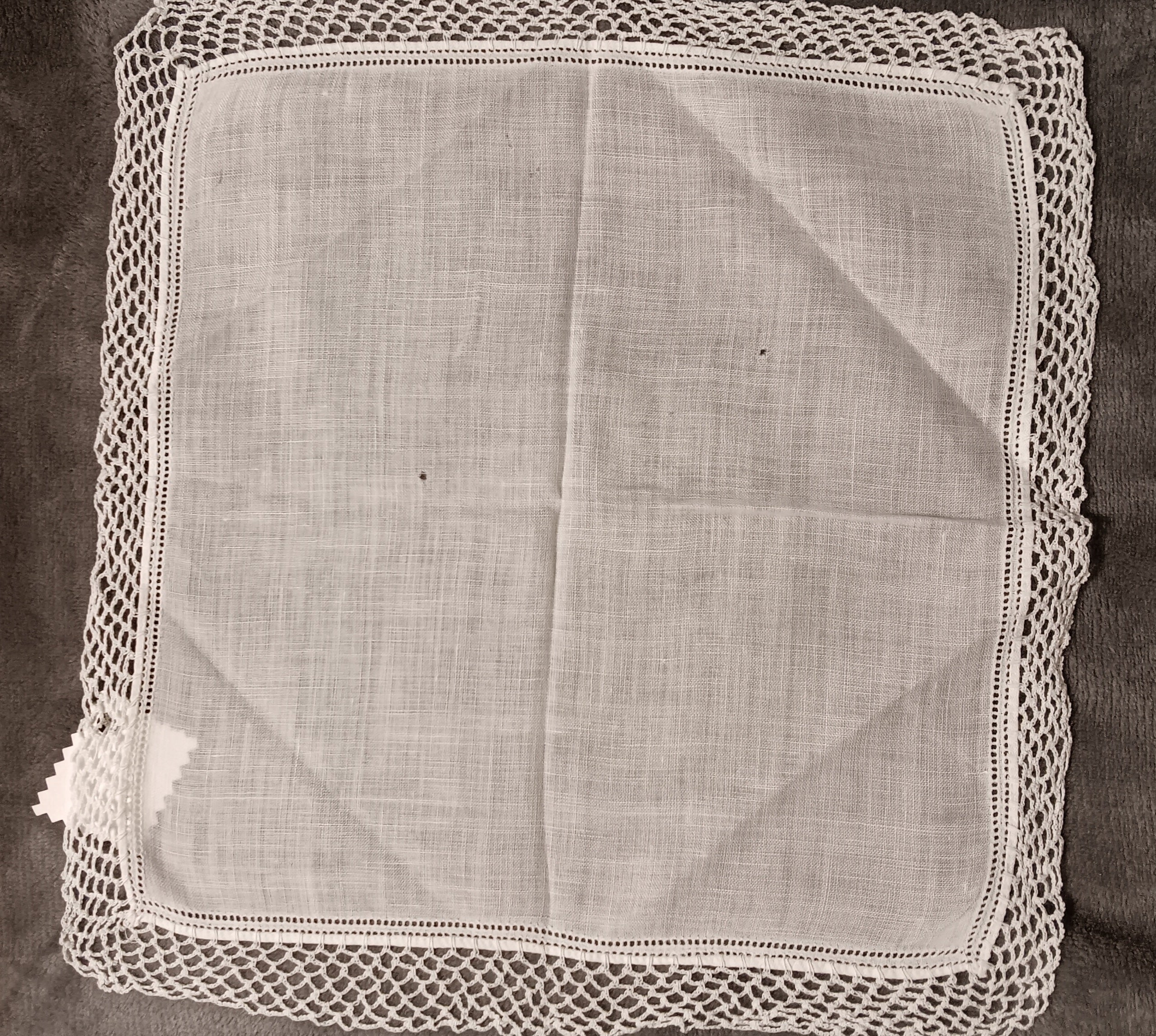 White handkerchief with white lace