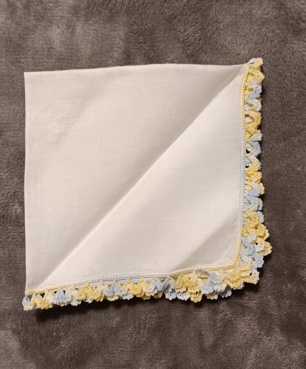 White handkerchief with blue and yellow lace
