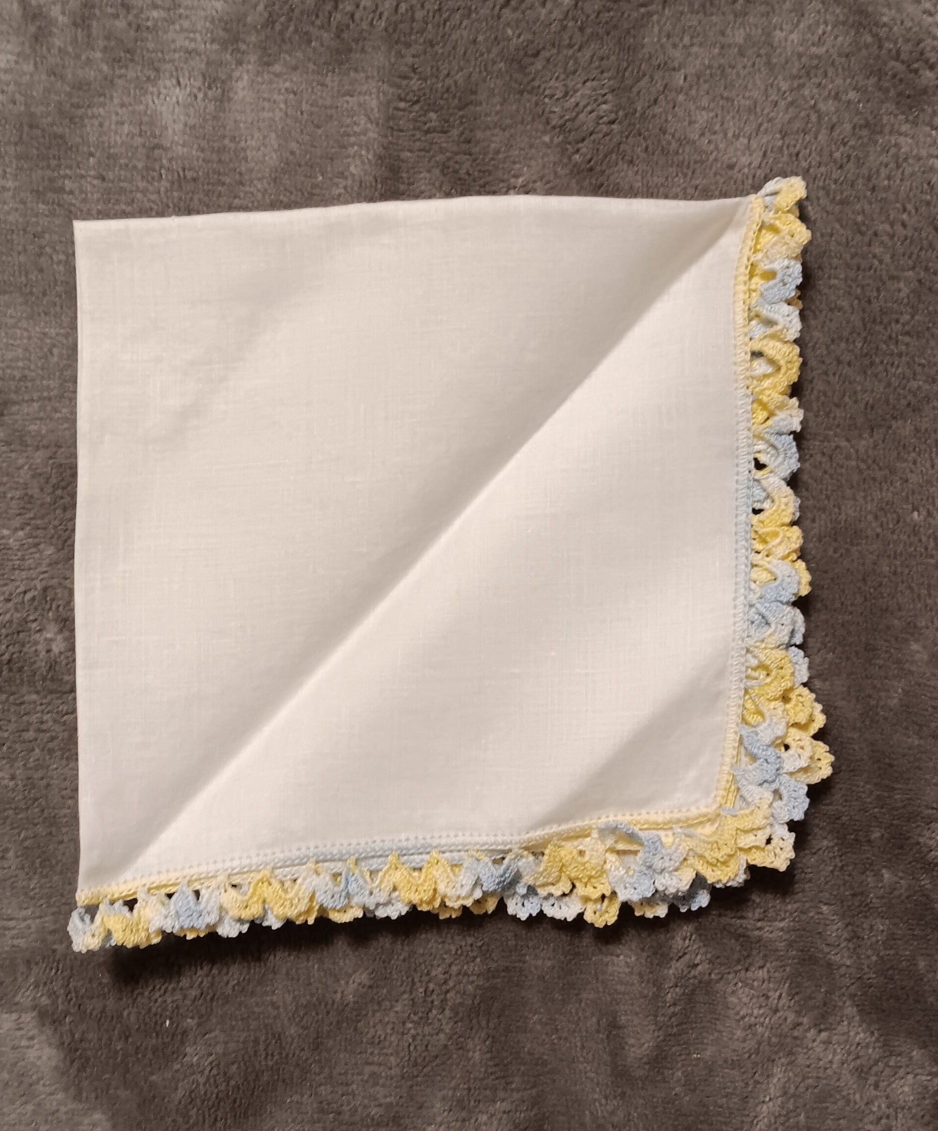 White handkerchief with blue and yellow lace