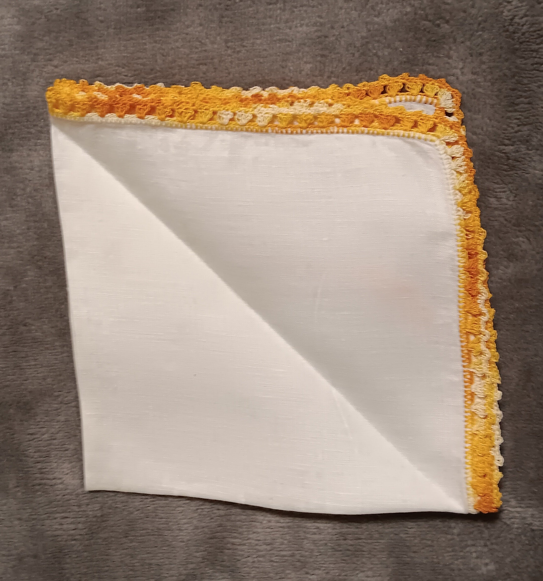White handkerchief with orange lace