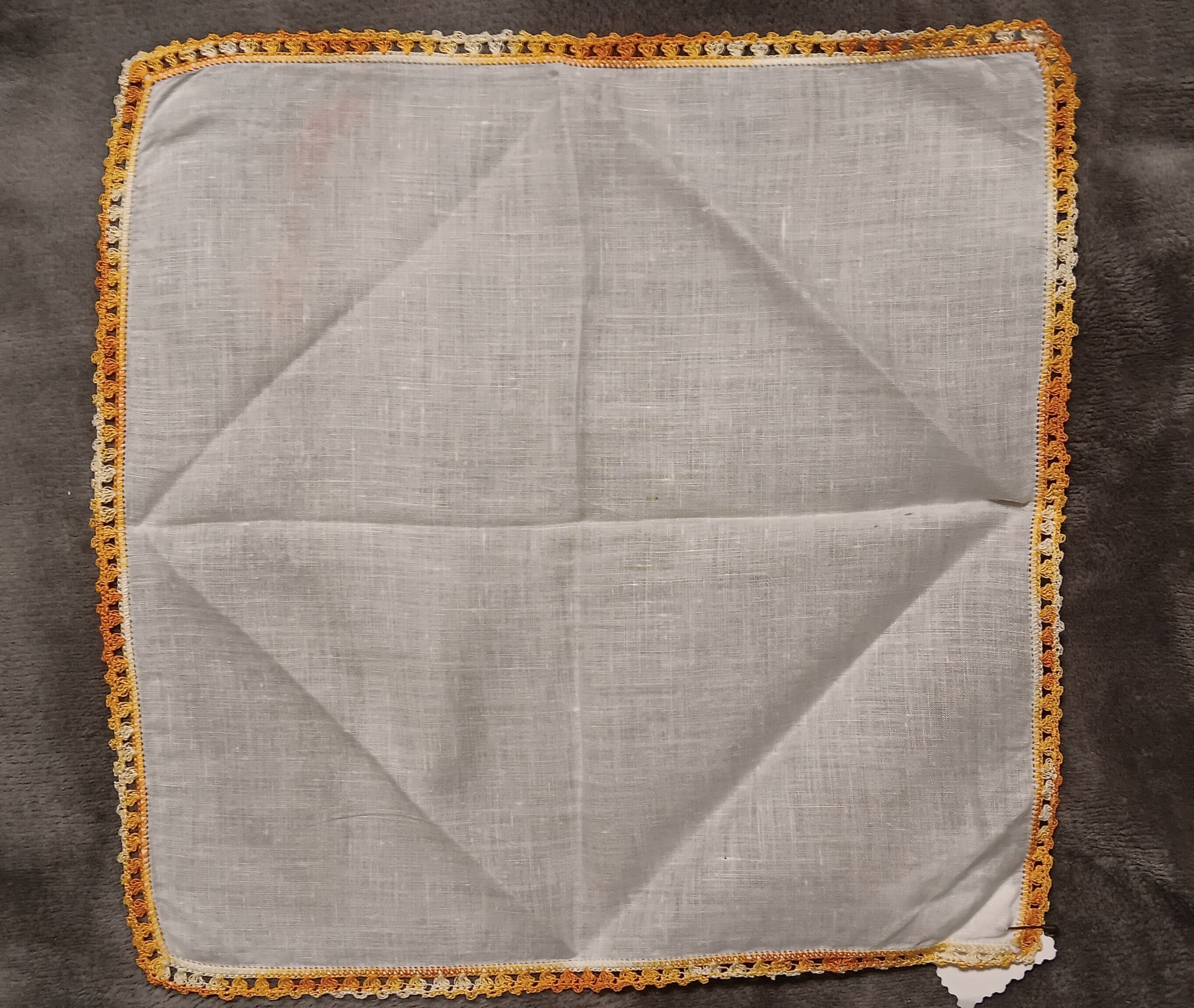 White handkerchief with orange lace